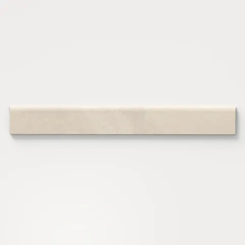 Matte beige bullnose tile with soft stone-like veining, ideal for polished edge finishing on backsplashes, accent walls, or bathroom surrounds.