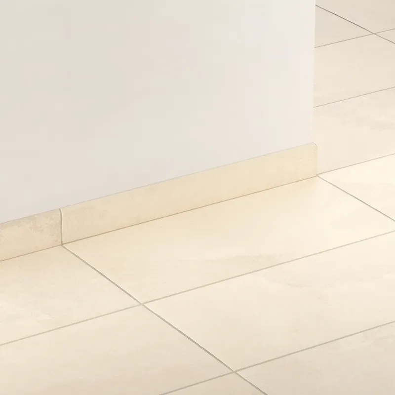 Matte beige bullnose tile with subtle stone-like texture, offering a clean, durable transition from floor to wall in modern or classic interiors.