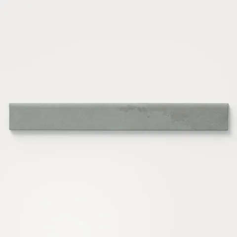 Matte bullnose tile in gray and soft blue tones with a soft stone-like texture, perfect for clean edge transitions on walls, backsplashes, or shower niches.