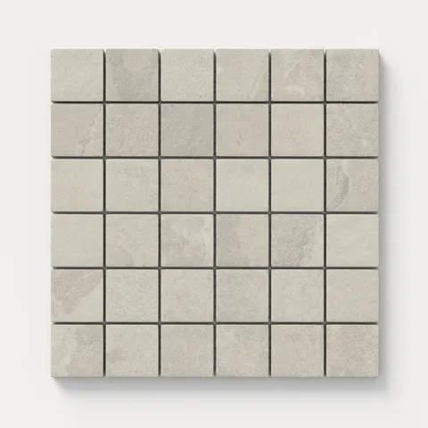 Matte square mosaic tiles in earthy gray hue with a soft stone-like texture, offering a warm and natural feel ideal for walls, floors, or accent surfaces.