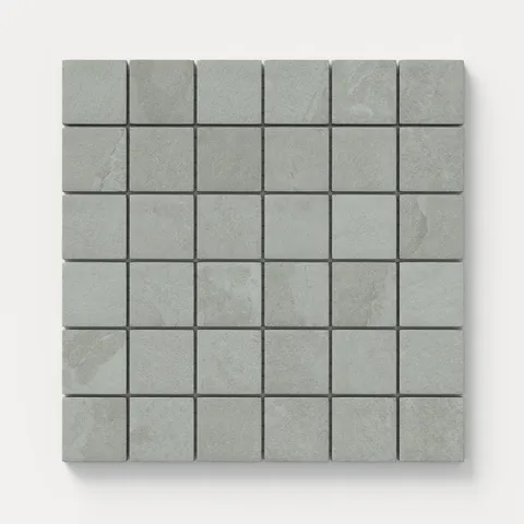 Matte square mosaic tiles in gray and soft blue hues with a subtle stone-like texture, perfect for creating a calm, modern look on walls, floors, or accent areas.