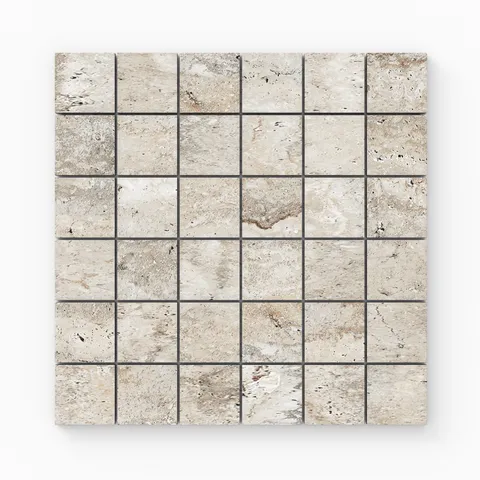 Warm beige travertine-look porcelain 2x2 matte mosaic tile with soft tonal shifts, subtle veining, and an authentic stone appearance.