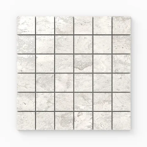 Light gray travertine-look porcelain 2x2 polished mosaic tile with delicate stone variation, soft veining, and a clean reflective sheen.