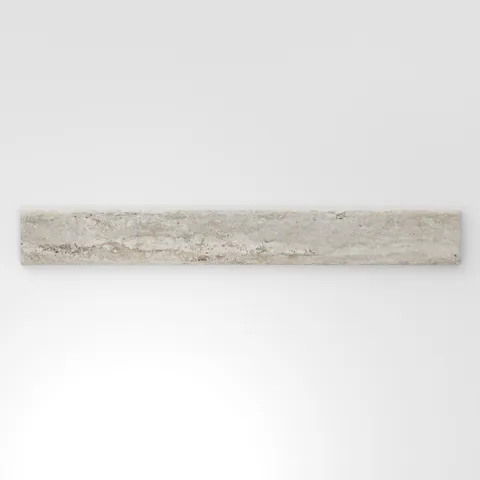 Warm beige travertine-look porcelain 3x24 matte bullnose tile with soft stone movement, gentle veining, and a finished edge.