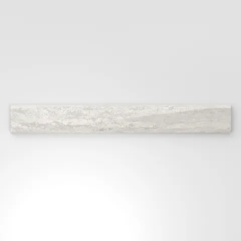 Light gray travertine-look porcelain 3x24 polished bullnose tile with delicate veining, soft tonal movement, and a rounded profile.