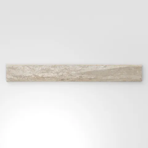 Neutral beige travertine-look porcelain 3x24 polished bullnose tile showcasing gentle stone variation and a smooth contoured edge.