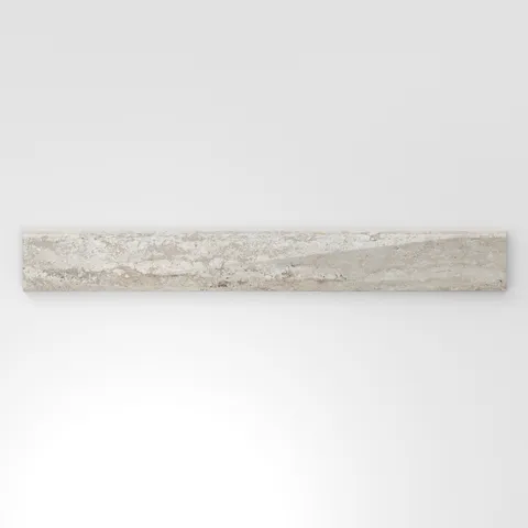 Warm beige travertine-look porcelain 3x24 polished bullnose tile with subtle horizontal veining and a softly rounded, glossy finish.