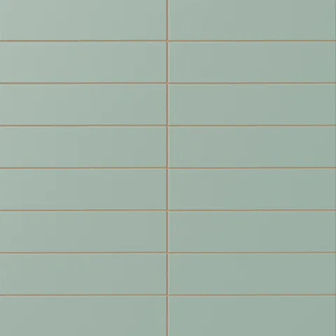 Matte subway tile in a soft sage green tone with a flat rectangular design, muted botanical color, smooth surface texture, and warm grout contrast.