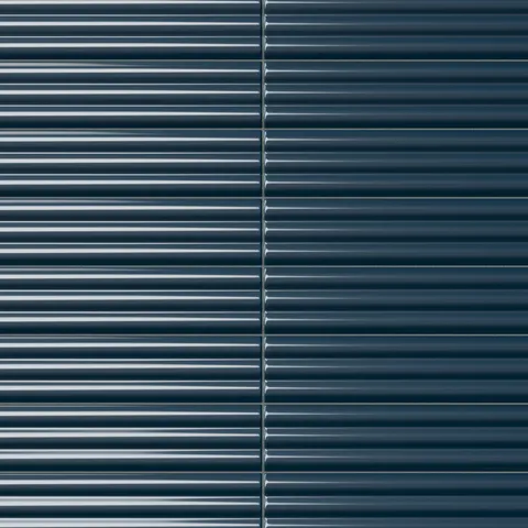 Reeded rectangular tile in a dark midnight blue tone with a glossy finish, reflective horizontal fluting, deep glaze movement, and a dramatic sculpted surface.