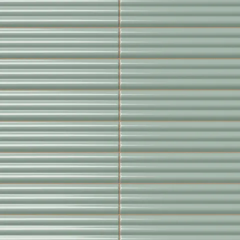 Ridged rectangular tile in a soft sage green tone with a glossy finish, rounded edges, stacked horizontal layout, and subtle handcrafted surface variation.