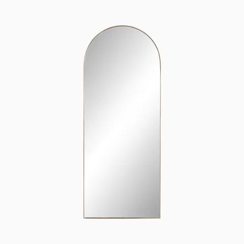 Tall arched floor mirror with a slim polished brass aluminum frame, designed for full-length reflection in versatile interiors.