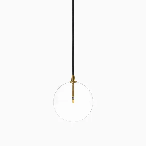 Modern pendant light with a clear glass globe, suspended by a black cord and featuring a slender vertical socket in burnished brass.