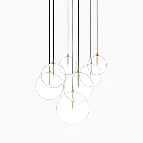 Chic burnished brass chandelier with suspended clear glass globes and slender gold stems for a luxe floating effect.