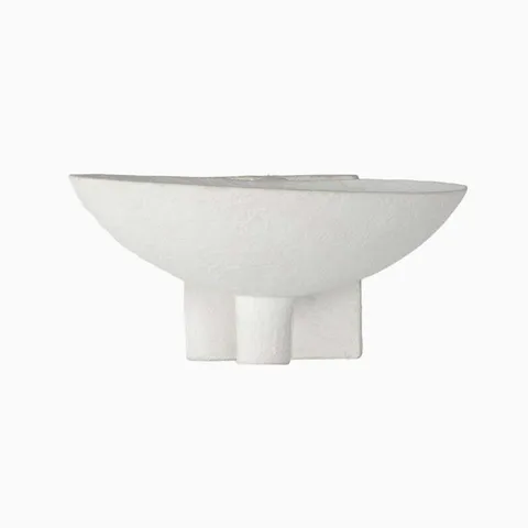 Sculptural matte white plaster sconce in a half-bowl silhouette with modern pedestal-style base.