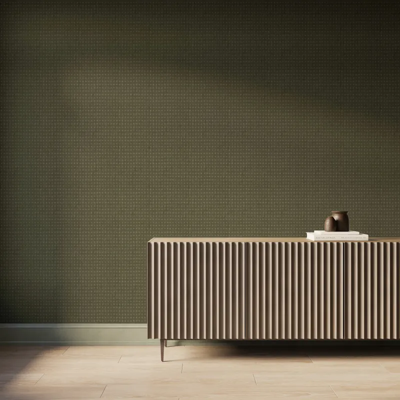 Modern interior featuring olive green crosshatch wallpaper that creates a subtle woven texture, paired with a fluted wood console cabinet, light wood flooring, and soft natural light casting gentle shadows across the wall.