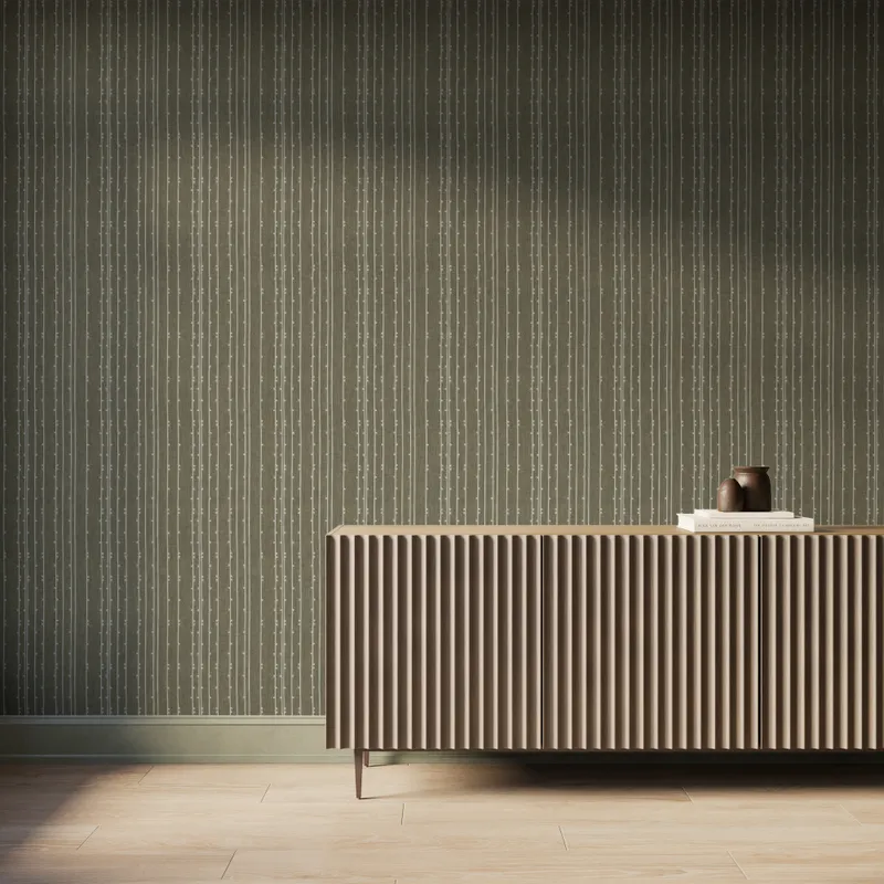 Olive green textured wallpaper with vertical dashed stripe pattern, styled with a modern fluted wood console.