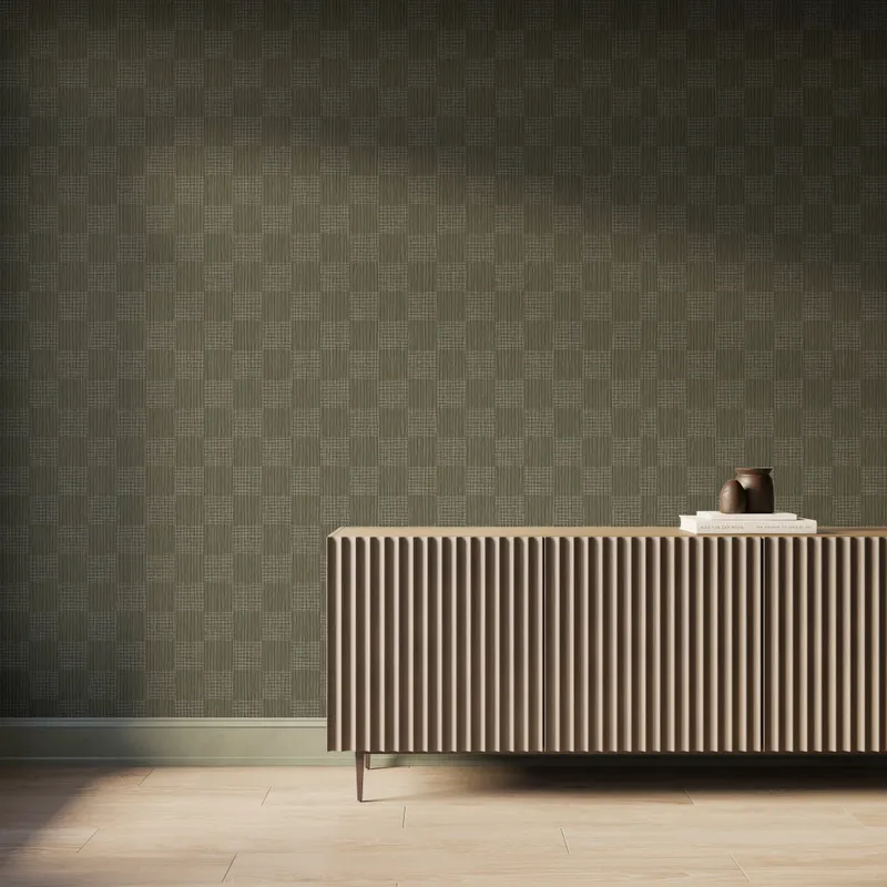 Rich olive green base and fine off-white woven geometric wallpaper with a subtle checker pattern, styled in a modern interior behind a fluted wood sideboard with decorative vases.