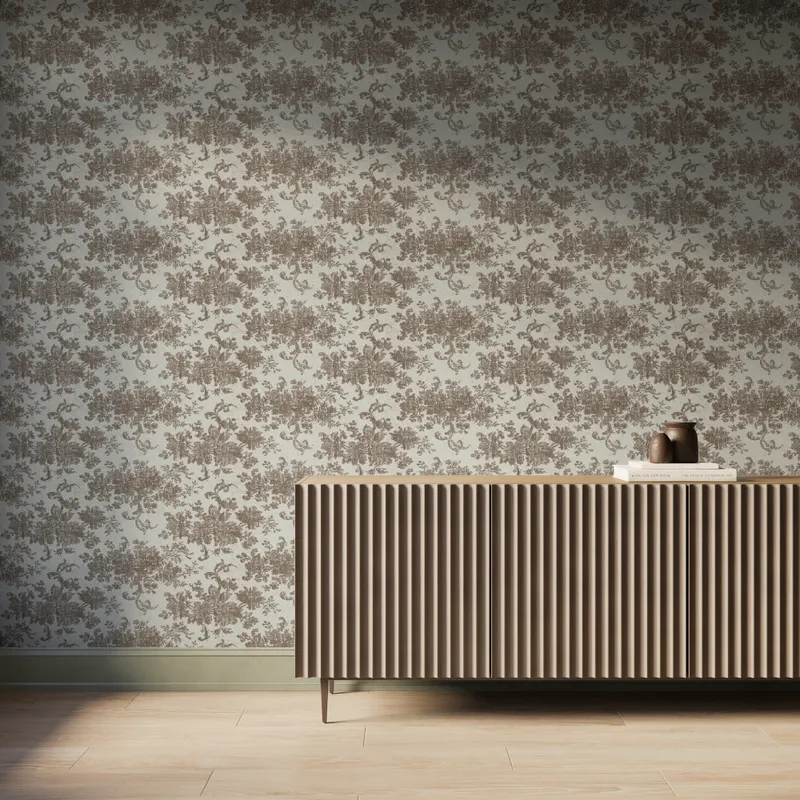 Interior scene featuring Brocade Wallpaper in Taupe II with a grayish brown damask floral motif over a matte off-white background, styled with a fluted wood console cabinet, decorative books and vases, and light wood flooring with soft natural light.