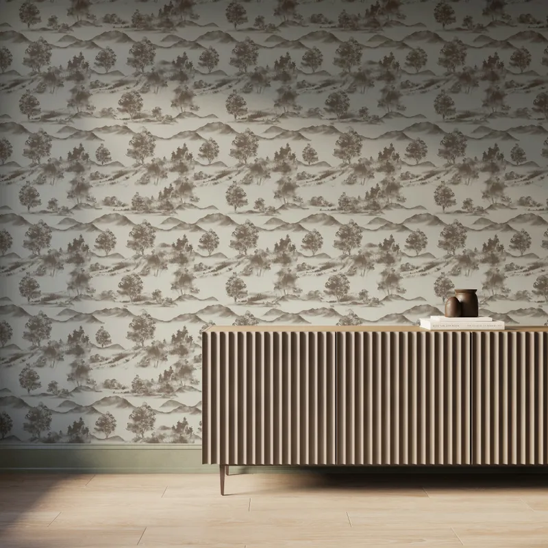 White scenic landscape wallpaper with dark taupe trees and mountain silhouettes behind a modern ribbed wood console table.