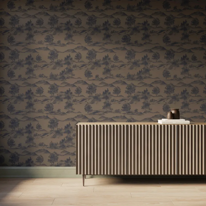 Brown scenic landscape wallpaper with trees and mountain silhouettes behind a modern ribbed wood console table.