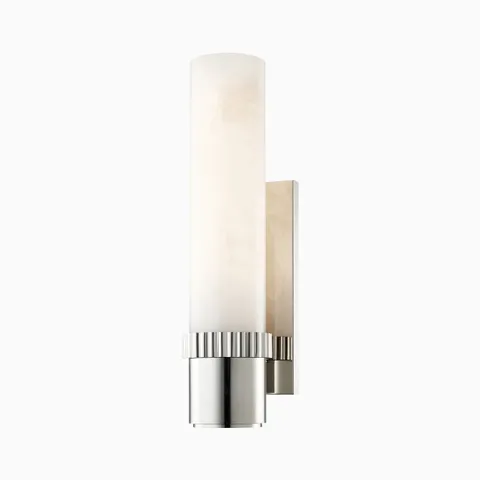 Asha wall sconce in polished nickel with a fluted metal base and cylindrical alabaster shade, offering sleek elegance with a soft glow