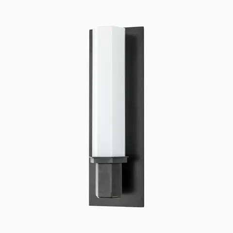 Designed with contrast in mind, the Curtis Wall Sconce in Old Bronze pairs a dark metal finish with crisp opal glass, fitting effortlessly in modern or industrial spaces.