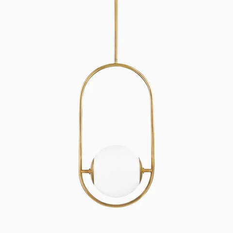 Contemporary pendant light with a white glass globe suspended in a vertical oval vintage brass frame and rod for ceiling mounting.