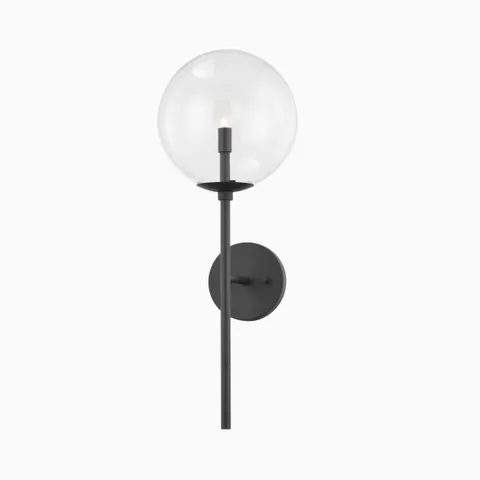 Garner wall sconce in soft black with a slender rod and clear globe shade, delivering modern elegance with a sculptural silhouette.