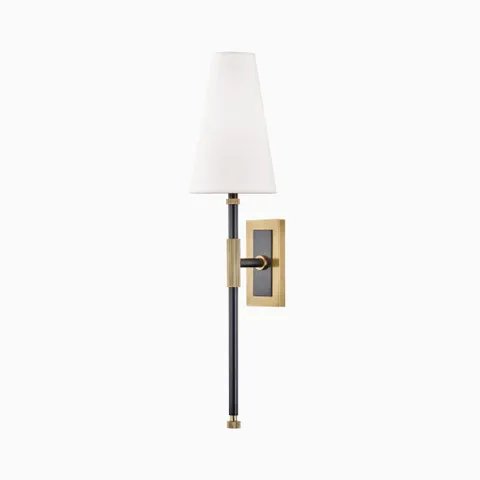 Wall sconce with white linen tapered shade, aged old bronze and black metal stem, and rectangular backplate for soft, ambient light.