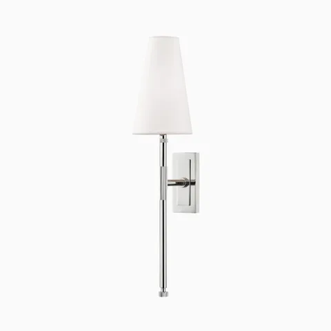 Wall sconce with polished nickel finish, slender metal stem, white linen tapered shade, and compact rectangular backplate for soft ambient lighting.