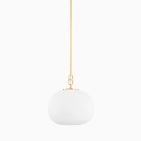 Our Kaley 11” Pendant in Aged Brass features a frosted elliptical glass shade and slender suspension stem, offering soft, elegant lighting overhead.