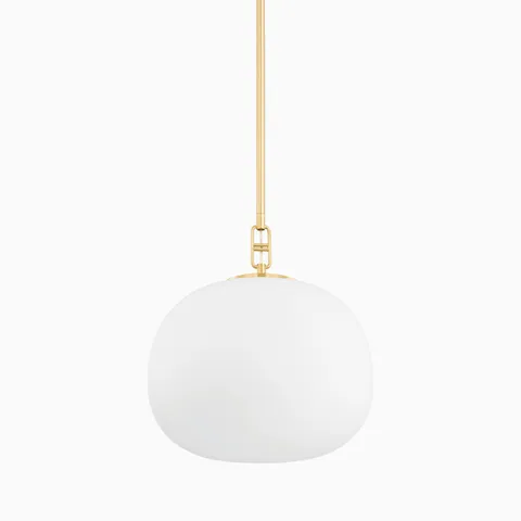 Our Kaley 16” Pendant in Aged Brass features a wide, frosted elliptical glass shade and slender brass stem, ideal for overhead lighting in open spaces.