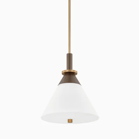 Our Lennie 16” Pendant in Patina Brass / Bronze is defined by its oversized opal cone shade and layered mixed-metal details, delivering structured contrast with a warm tone.