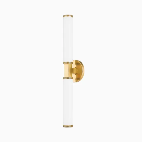 Sleek vertical wall sconce with dual cylindrical white glass cylinder lights and a central brass mount for modern symmetry