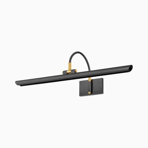 Slim black picture light with brass accents and a curved arm, offering refined illumination for artwork or mirrors