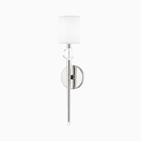 Polished nickel wall sconce with a tapered stem, clear crystal detail, and white fabric shade for refined, timeless elegance