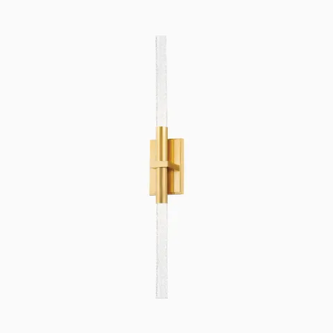 Slim vertical wall sconce with textured glass rods and an aged brass rectangular mount, offering a sleek and modern minimalist design.