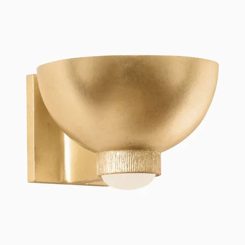 Vintage gold leaf wall sconce with textured bowl shade and frosted globe bulb, mounted on a square backplate for warm ambient lighting.