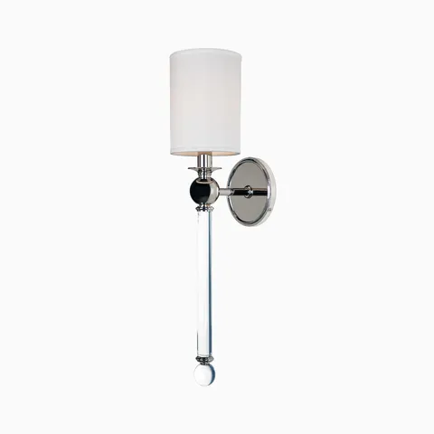 Polished nickel wall sconce with white cylindrical shade, crystal rod detail, and round backplate for an elegant modern lighting accent.