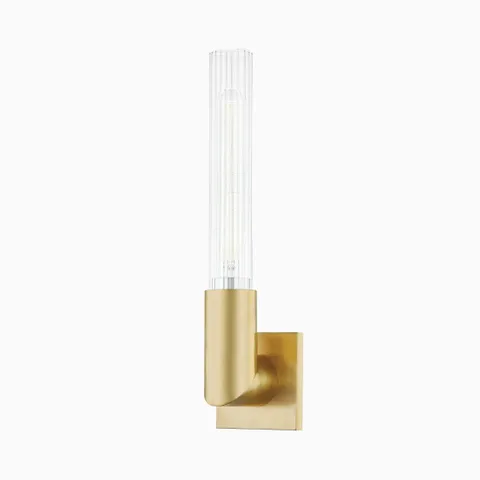 17 inches wall sconce with aged brass square backplate, curved arm, and tall fluted glass shade for a sleek, architectural accent.
