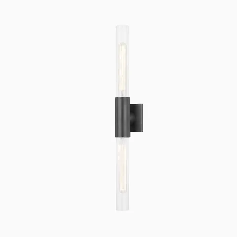 28" wall sconce with matte old bronze finish, central rounded mount, and dual fluted glass column shades for modern ambient lighting.