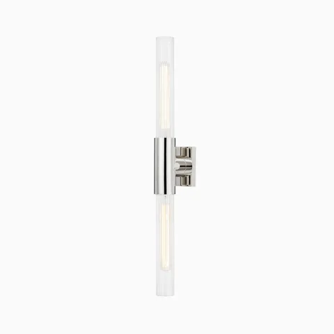 28" wall sconce with polished nickel center mount, twin fluted glass column shades, and sleek silver finish for modern ambient lighting.