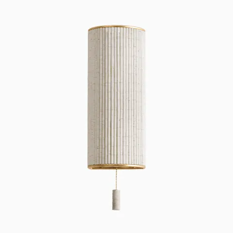 Wrapped in strands of white coco beads, our Tisdale Wall Sconce in Vintage Gold Leaf features a vertical form with a dangling pull chain and soft ambient texture.
