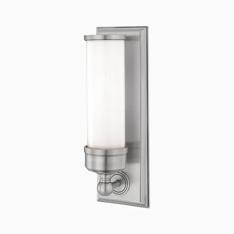 Brushed nickel wall sconce with cylindrical frosted glass shade and traditional base detailing for a timeless, transitional look