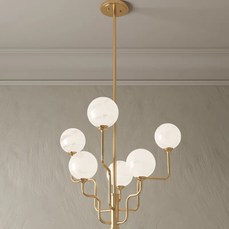 Elegant gold chandelier with curving arms and six glowing opal glass globes, creating a soft, organic lighting statement.