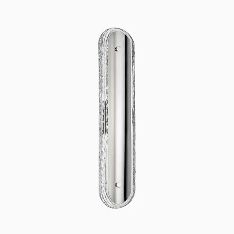 Bath and vanity light in burnished nickel with an elongated oval design and textured clear glass border, mounted vertically.