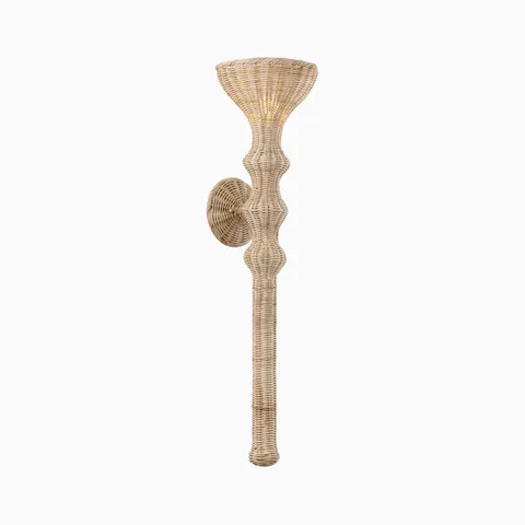 Woven rattan wall sconce with sculptural silhouette and natural finish, adding warm texture and organic coastal style lighting.