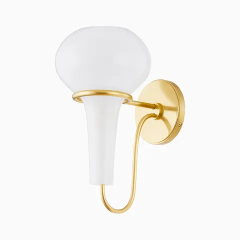Modern wall sconce with frosted glass globe shade and aged brass mount, featuring a sculptural curved arm and elegant minimalist design.