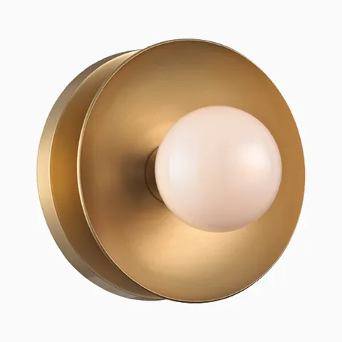 Aged brass bath and vanity light with a slim horizontal bar and round white glass shades for a clean modern look.