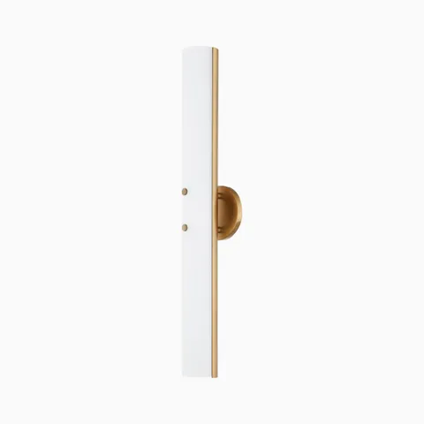 Patina brass wall sconce with slim vertical design, frosted white diffuser, and rounded backplate for a modern minimalist look.